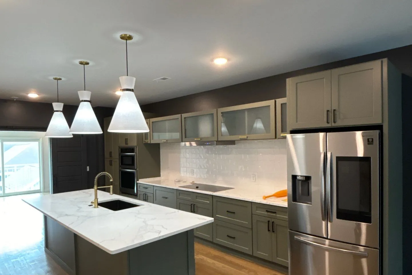 After: the same kitchen with the cabinets refinished