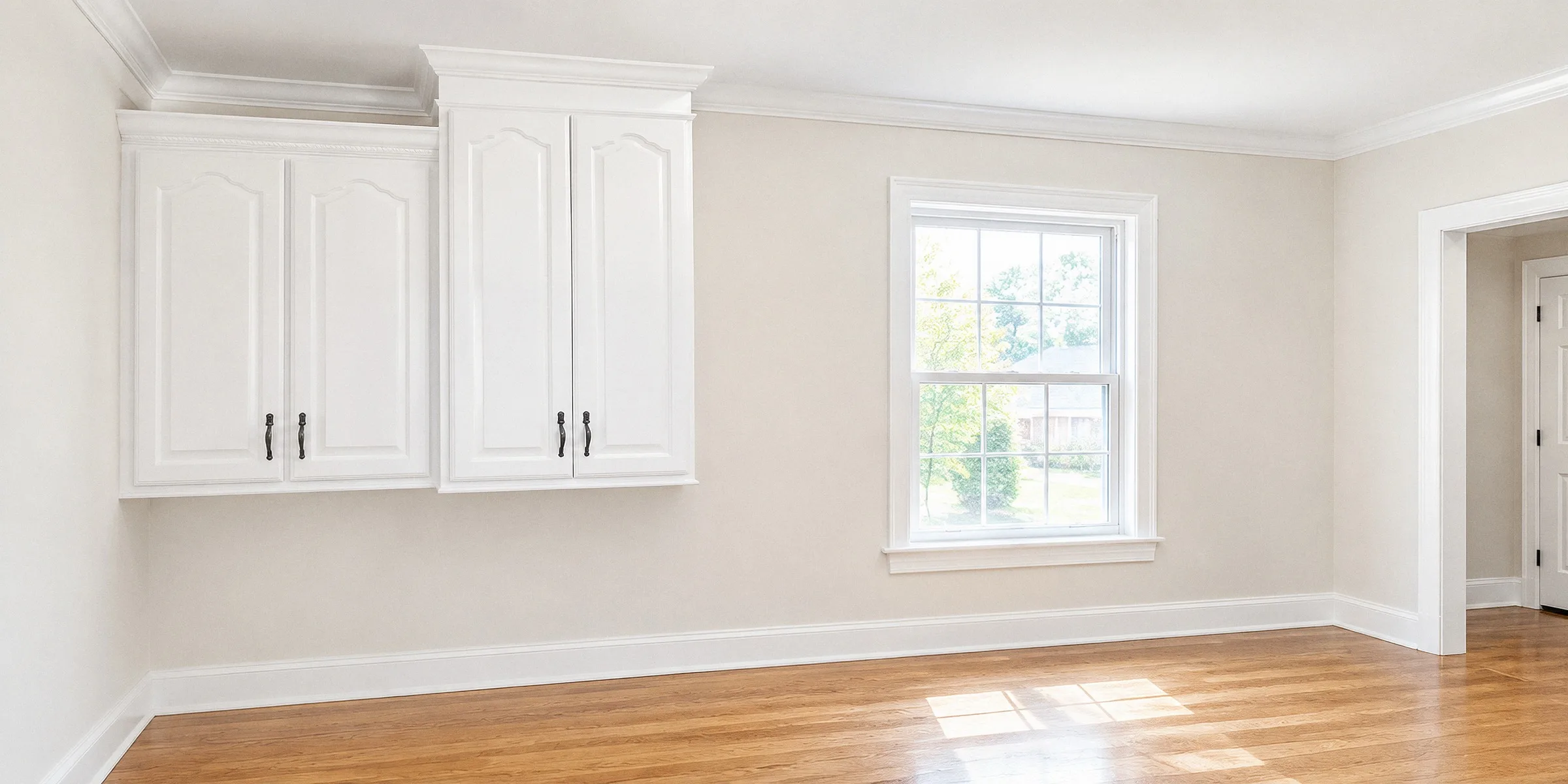 A freshly repainted room, finished and cleared, with crisp white trim