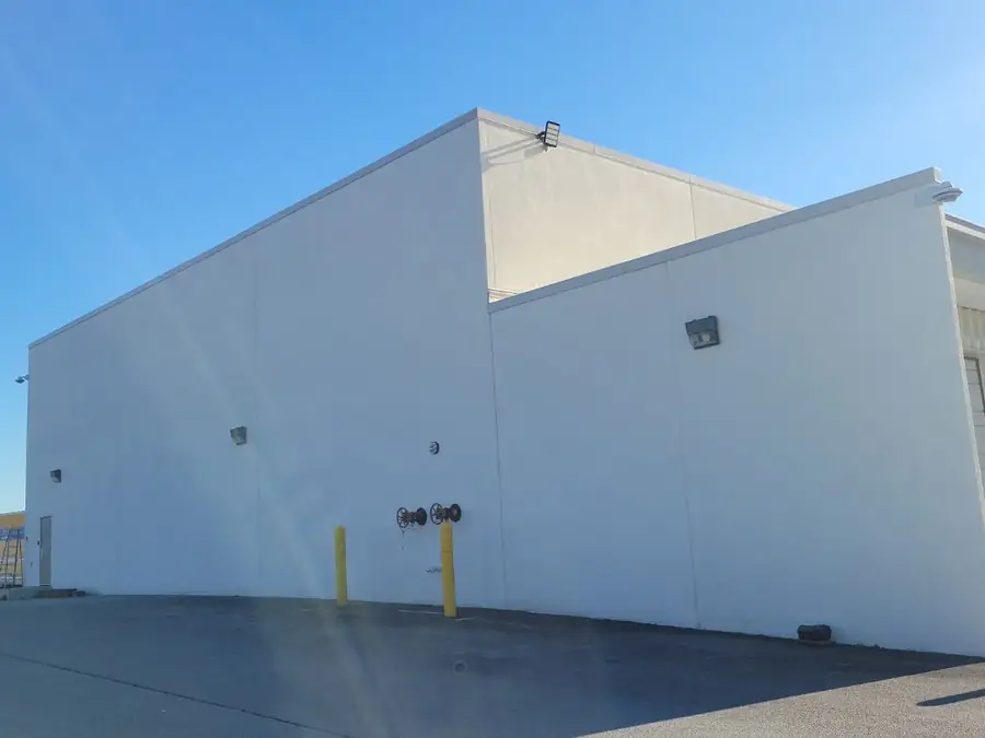 A warehouse elevation showing the height of wall to be coated