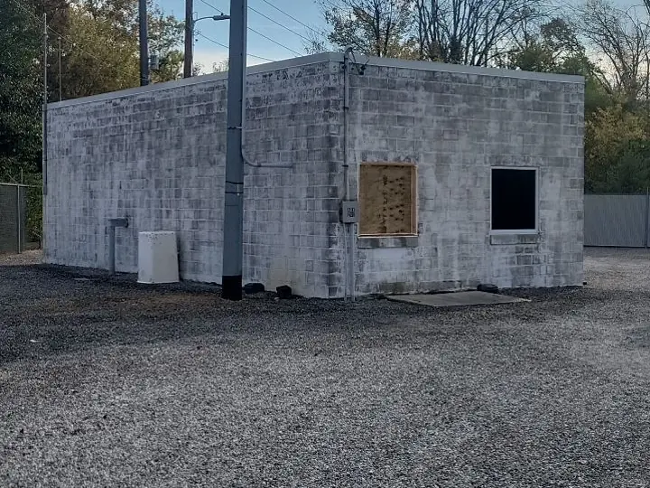 A concrete block building before painting