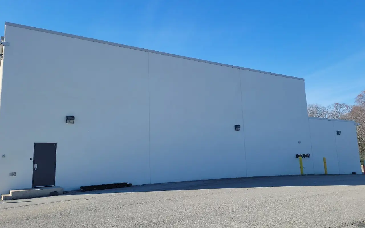 Commercial exterior painting in Chattanooga: a warehouse repainted in white