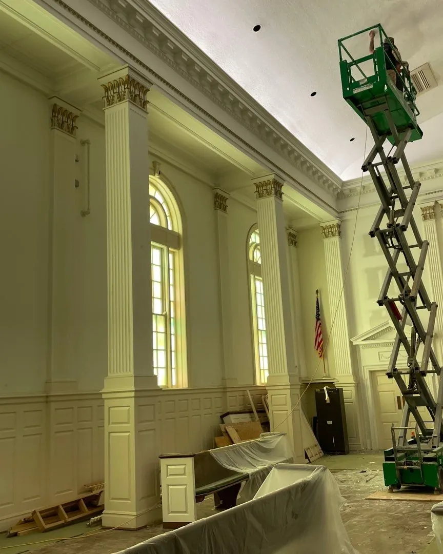 A commercial space draped and protected before work begins
