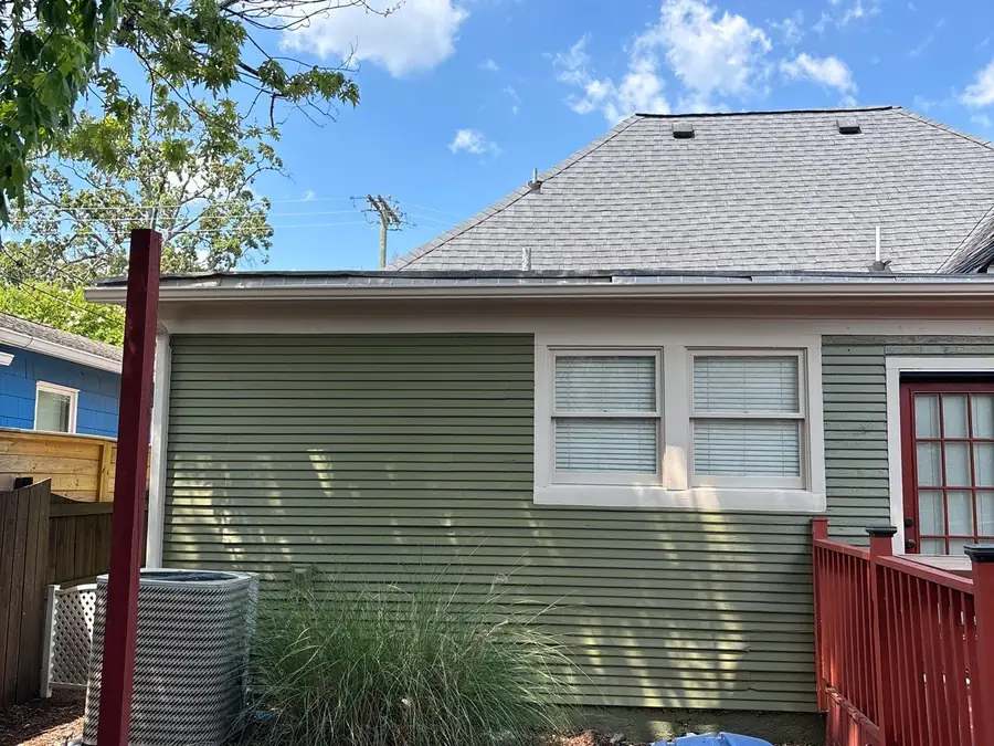 The same style of siding repaired and repainted in green