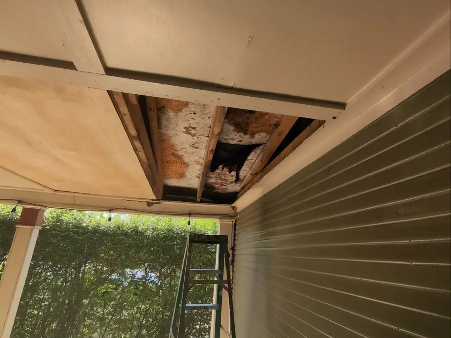 A soffit opened up to expose the framing behind it