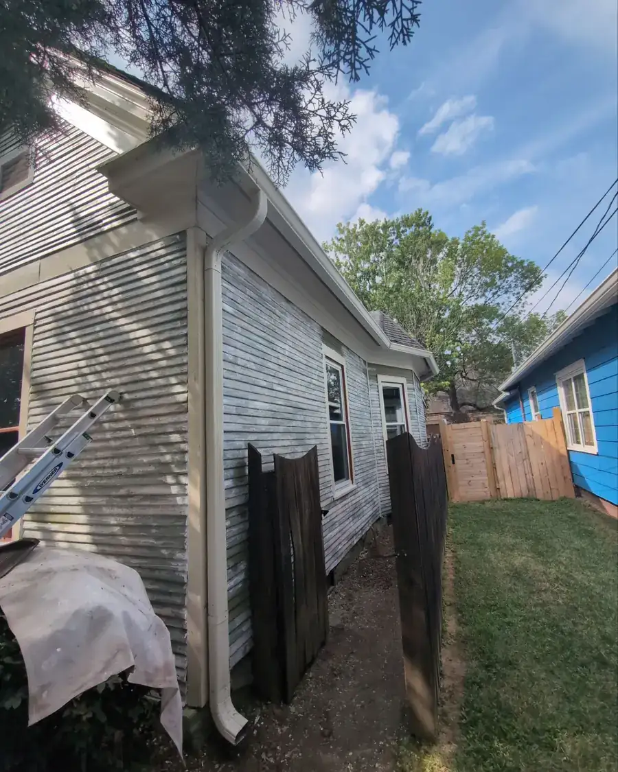Weathered siding stripped back during preparation before repainting