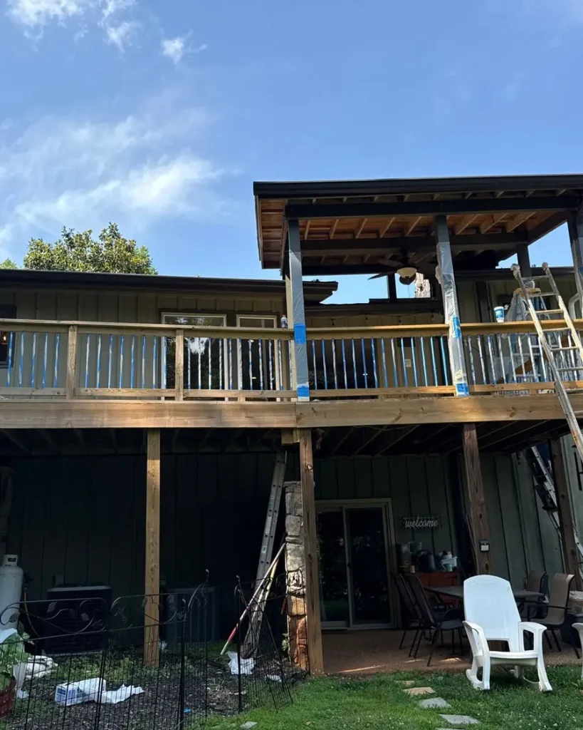 A deck taped and prepared before staining