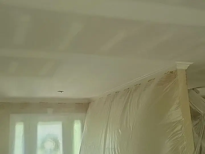 A room sealed floor to ceiling in plastic sheeting