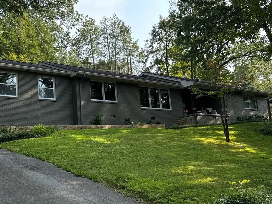 A brick house repainted in a light finish