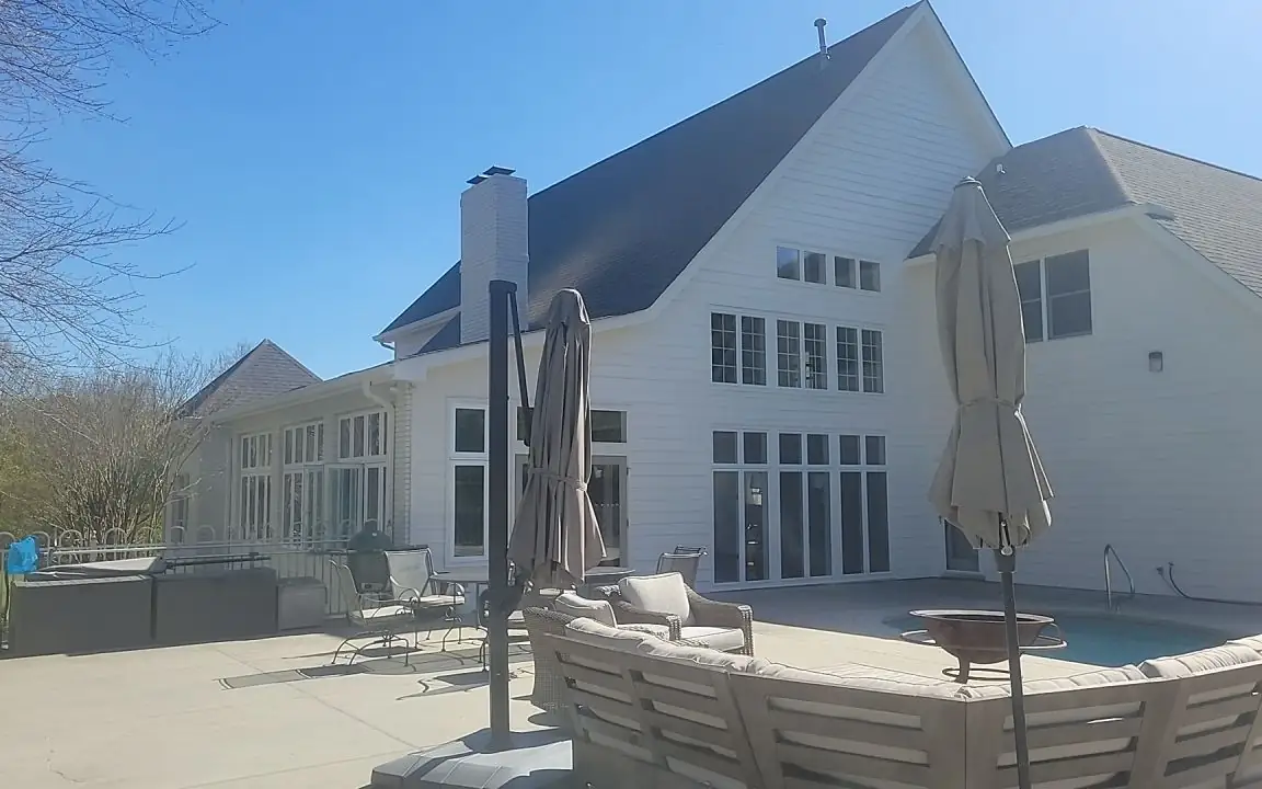 One of our painting projects: a large home exterior in Hixson, repainted in white