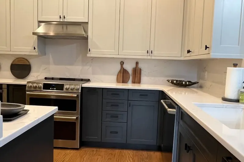 Refinished kitchen cabinets, white uppers and navy lowers, Chattanooga